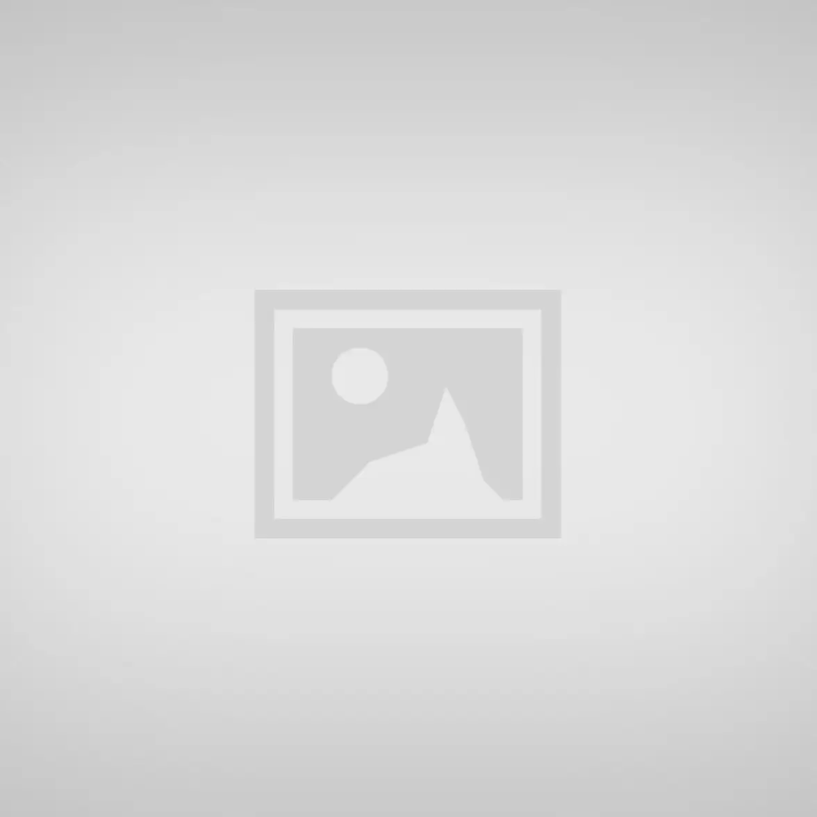 A serene beach with gentle waves and a sandy shore.